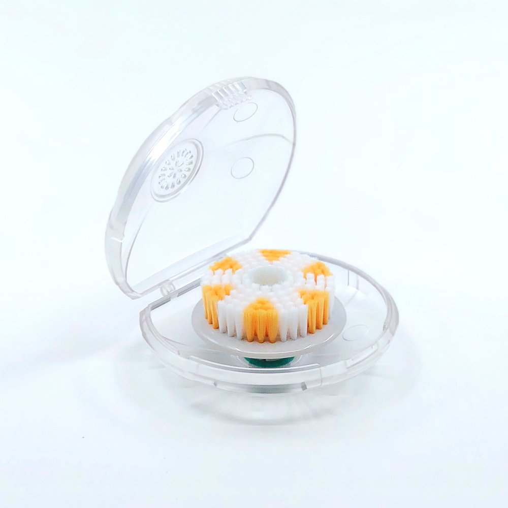 TAO Clean Orbital Brush Exfoliator Head on base station for hygienic sanitizing and drying