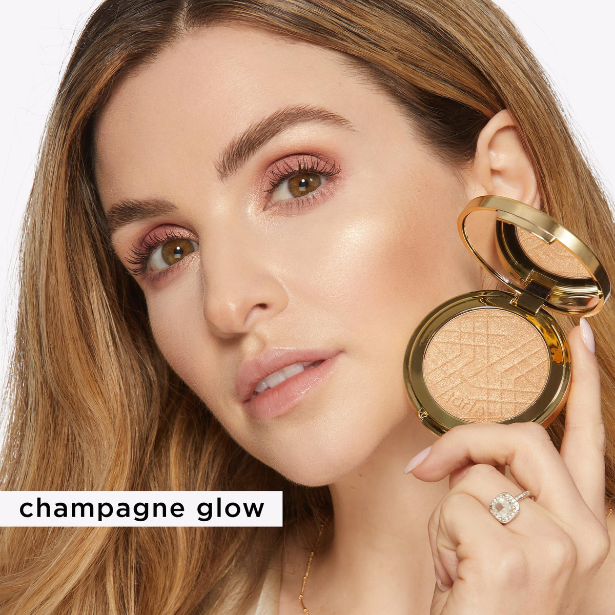 tarte rose-gold glow powder delivers a warm luminous finish on skin