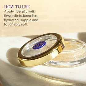 TATCHA Camellia Gold Spun Lip Balm gold flakes visible on lips for subtle gleam.