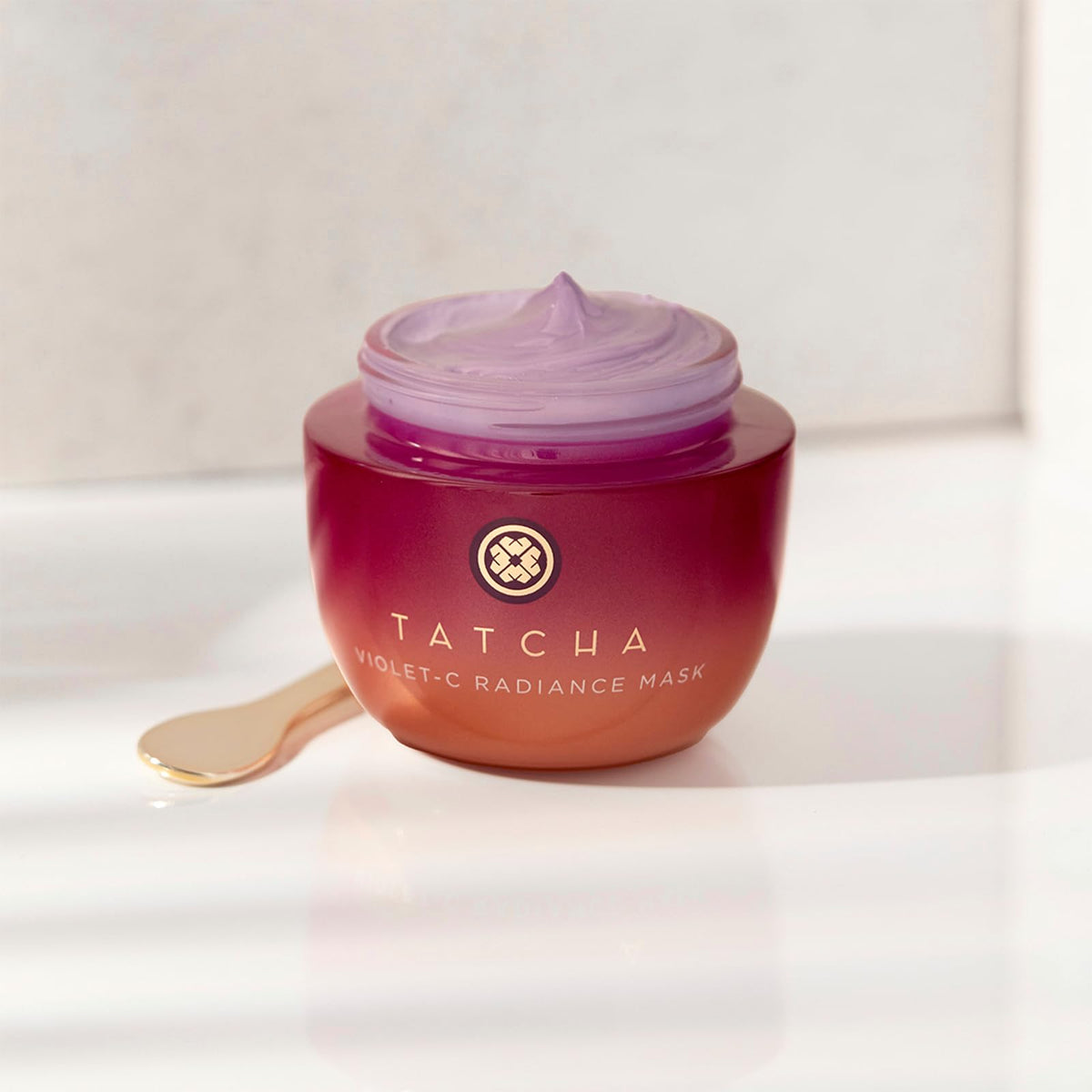 TATCHA Violet-C Radiance Mask application shot demonstrates easy rinse-off and smooth skin reveal.