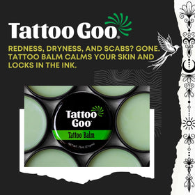 Hands applying Tattoo Goo to an area of healed or healing skin.