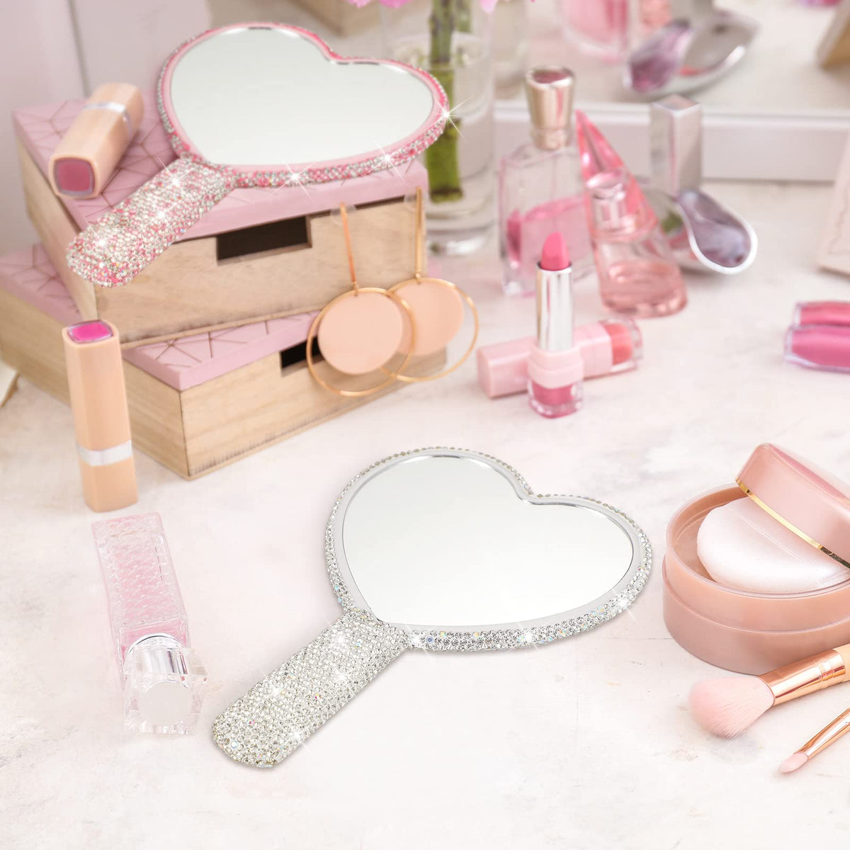 Tatuo bling mirror detail highlighting glamorous rhinestones and heart shape.