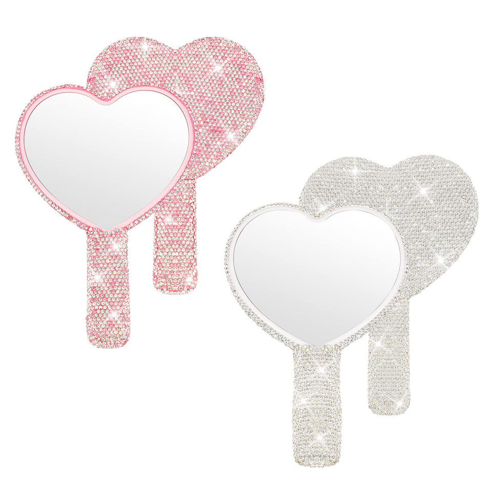 Tatuo heart mirror in pink with handle for on-the-go makeup touch-ups.
