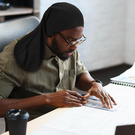 Tatuo unisex dreadcap in use during daily activities