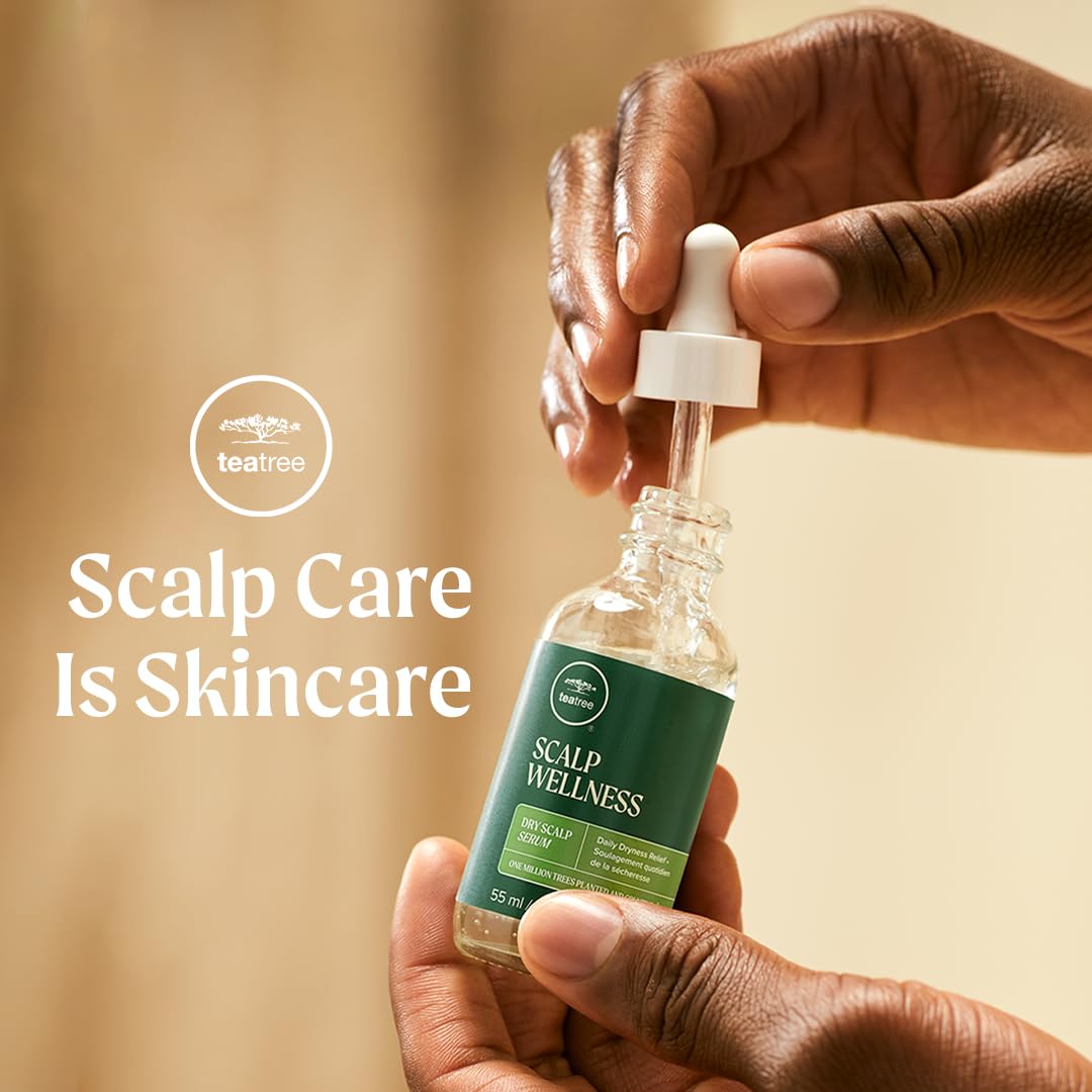 Hands applying Tea Tree Scalp Wellness Serum to the scalp during routine.