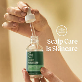 Tea Tree Scalp Wellness Serum being applied for lightweight scalp hydration.