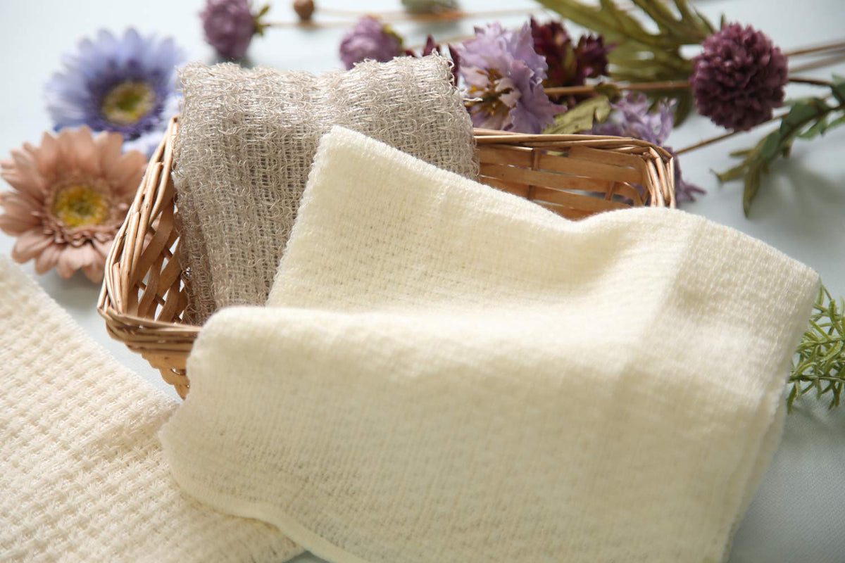 Terra Distribution exfoliating washcloth linen closeup shows premium weave for refined cleansing.