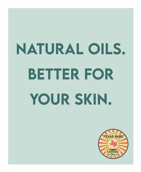 Texas Babe Tanning Oil Original in a natural setting reinforces reef-friendly formula.