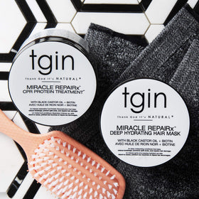 tgin Miracle RepairX mask application on curly hair for shine and softness.