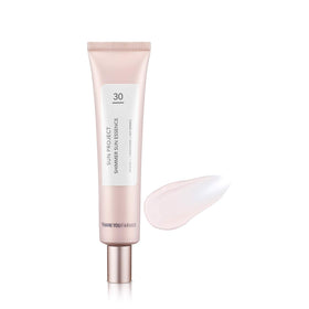 Thank You Farmer Sun Project Shimmer Sun Essence bottle close-up with radiant pink shimmer.