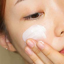Thank You Farmer Sun Project Shimmer Sun Essence texture on hand shows hydration and cooling.
