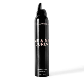 The Beachwaver Co. Me & My Curls Creamy Curl Mousse bottle highlights a lightweight, defining formula.