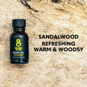 The Beard Club sandalwood beard oil being applied to the beard