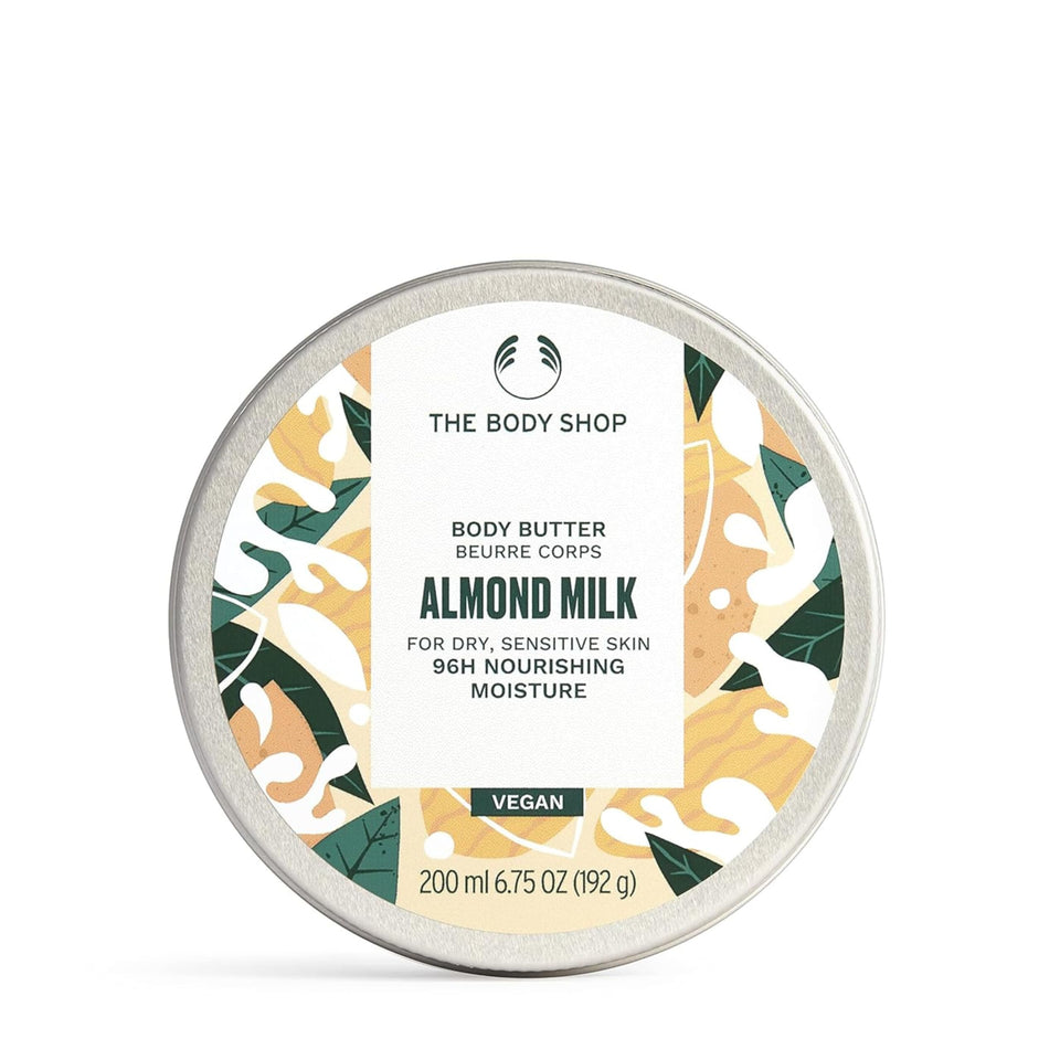 The Body Shop Almond Milk Body Butter jar close, rich moisturizing texture.