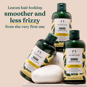 Banana Conditioner creamy texture on palm emphasizes smoothing action for manageable hair