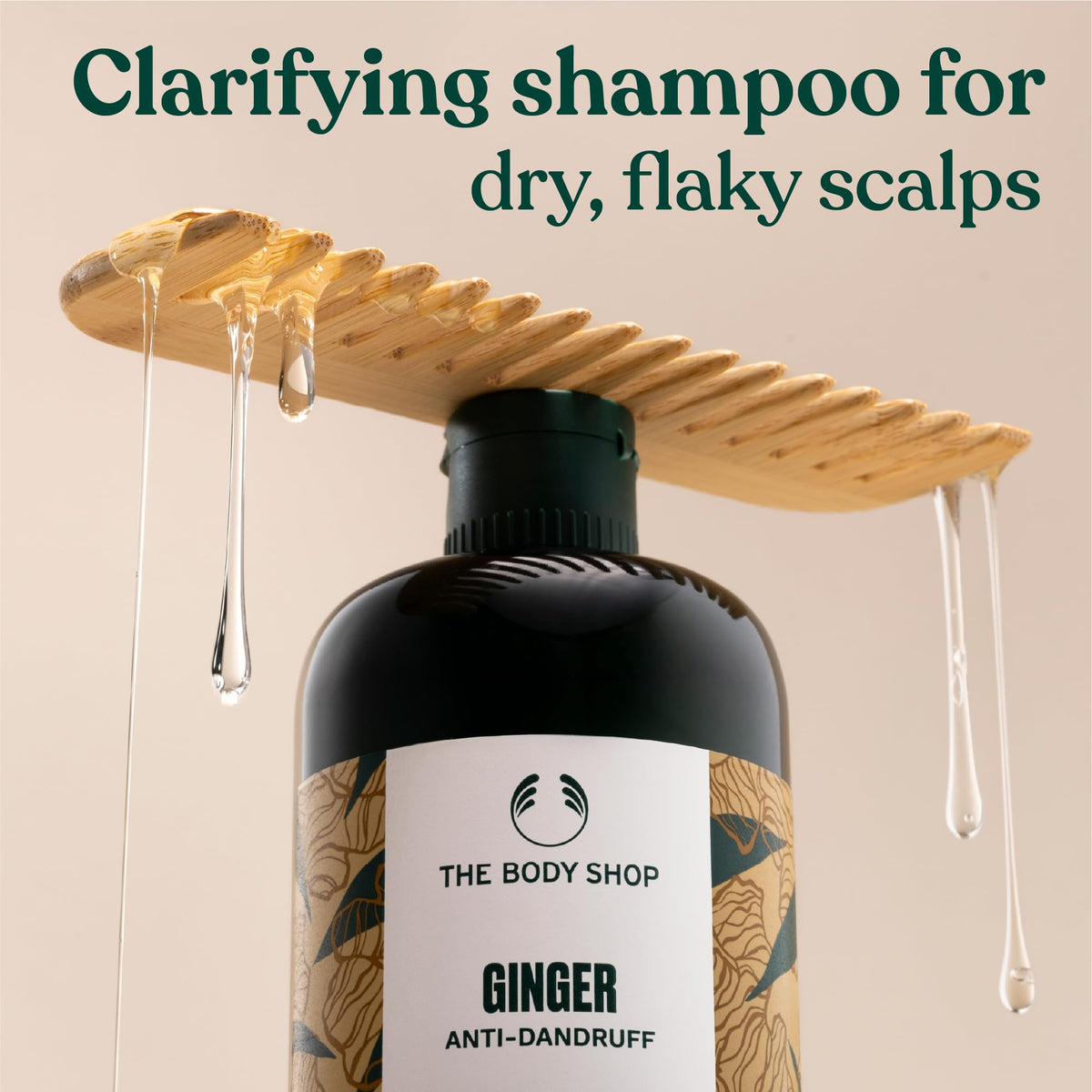 Close-up of Ginger Scalp Care Shampoo drops suggests energizing ginger for a refreshed scalp.