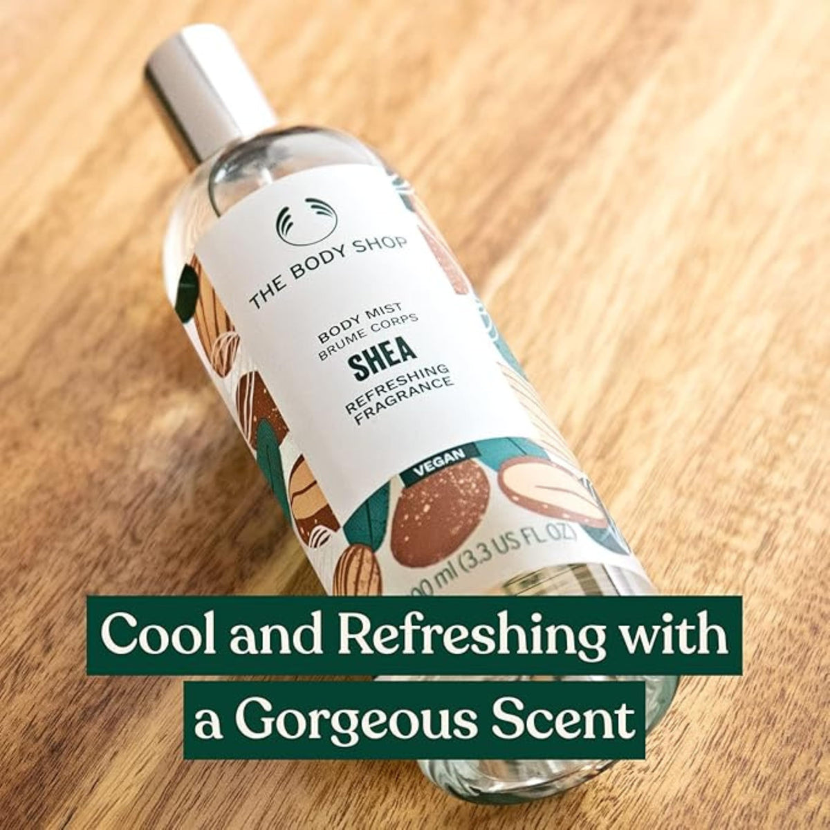 The Body Shop Shea Body Mist spritz application delivering a refreshing aroma.