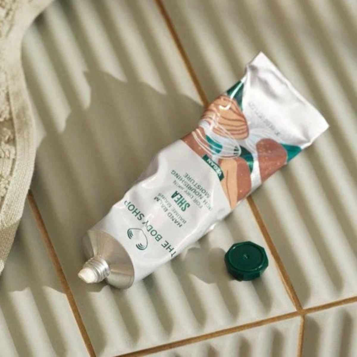 The Body Shop Shea Hand Balm vegan formula nourishes hands without greasiness.