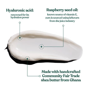 The Body Shop Vitamin E Intense Moisture Cream cap close-up rich, whipped texture.