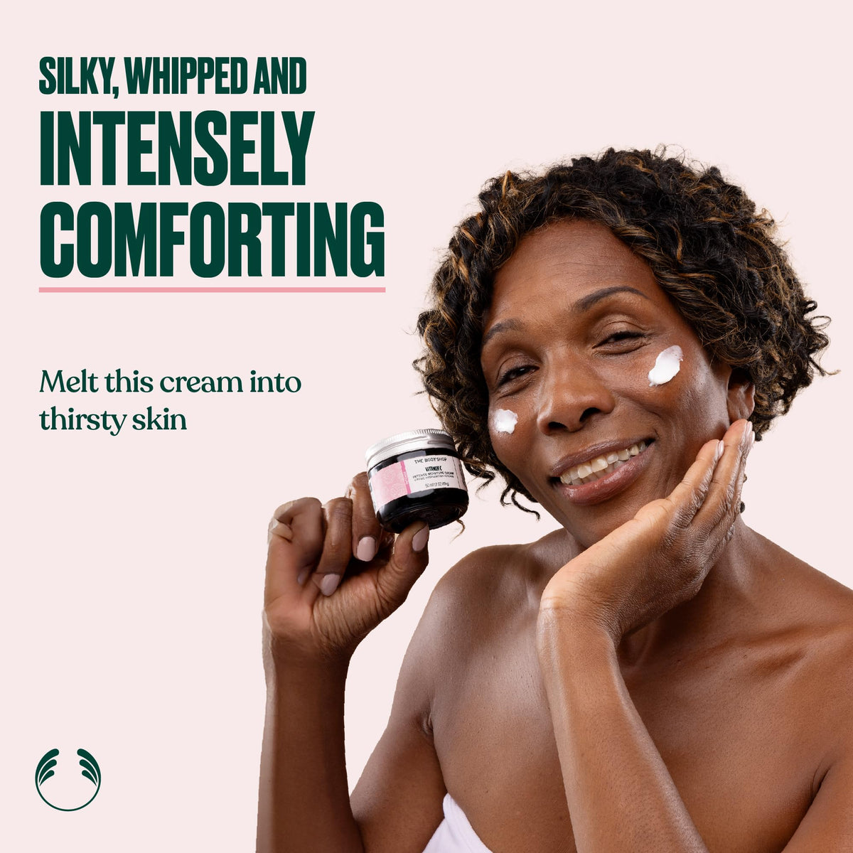 The Body Shop Vitamin E Intense Moisture Cream swirl applied for lasting softness.