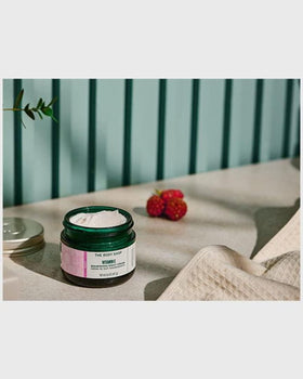 The Body Shop Vitamin E Night Cream with raspberry seed oil illustration highlights nourishing botanicals.