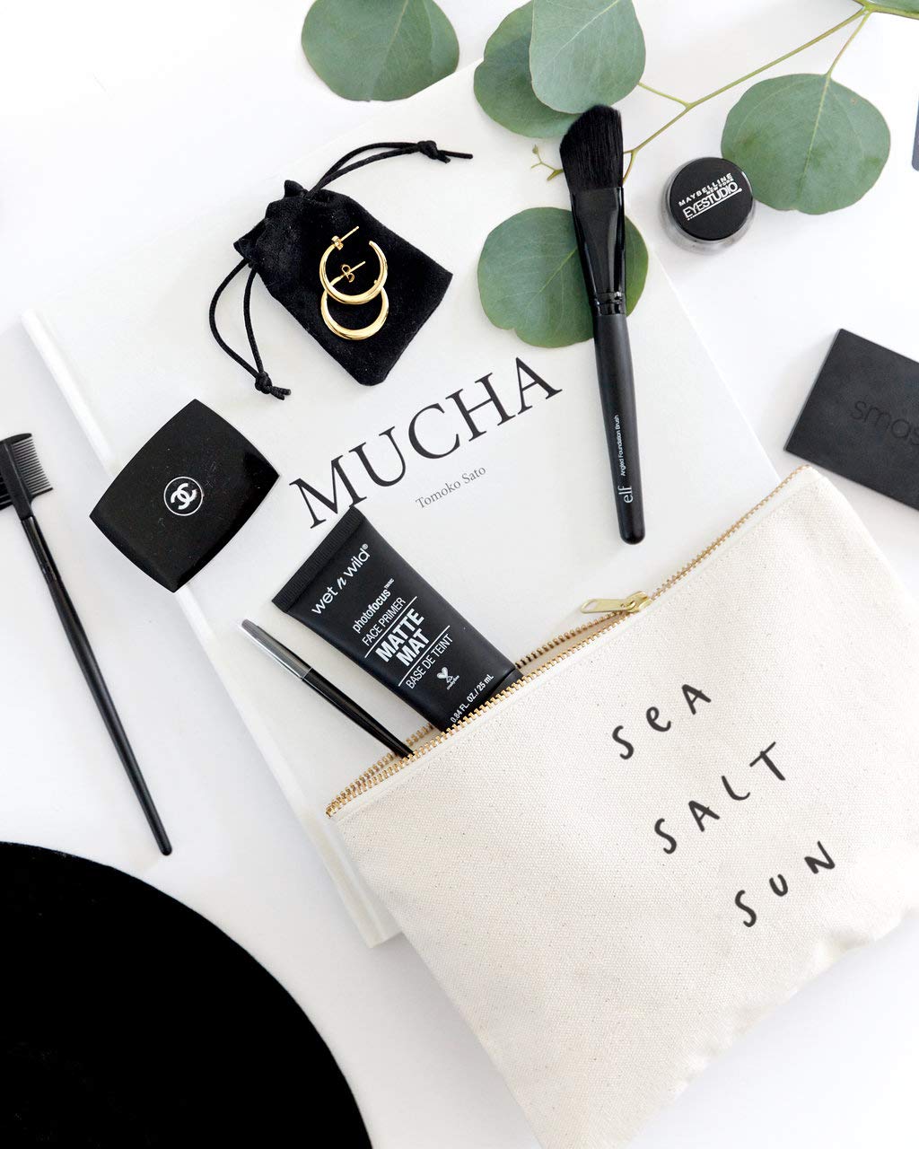 The Cotton & Canvas Co. Compact 9x6 bag fits cosmetics, phone, and keys.