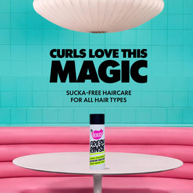 Applying The Doux Fresh Rinse to curly hair enhances detangling and softness
