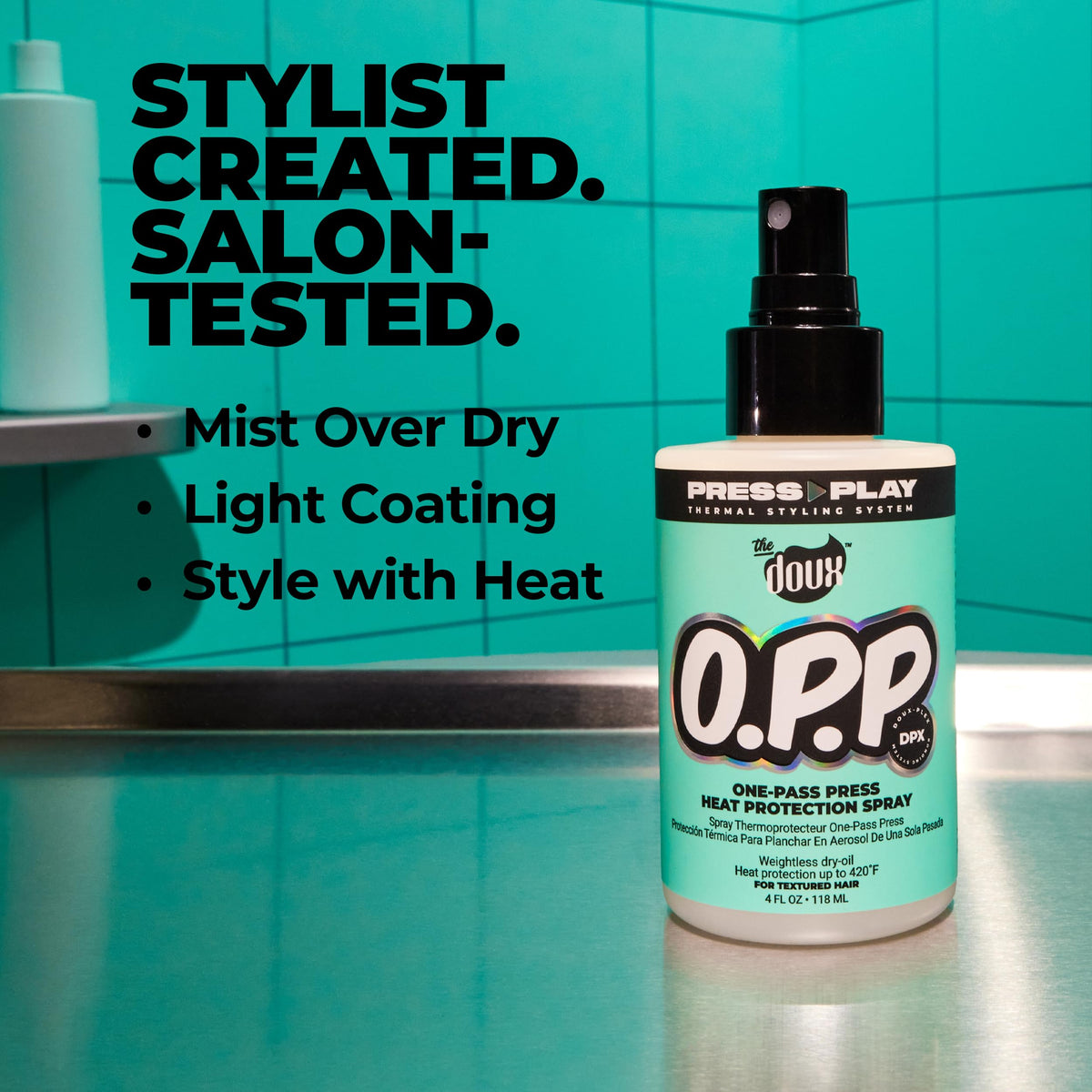 The Doux O.P.P. ONE-PASS PRESS mist closeup shows lightweight spray for even distribution.
