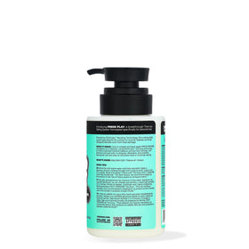 The Doux PRESS REWIND bottle side view highlights compact, daily-use packaging for curls