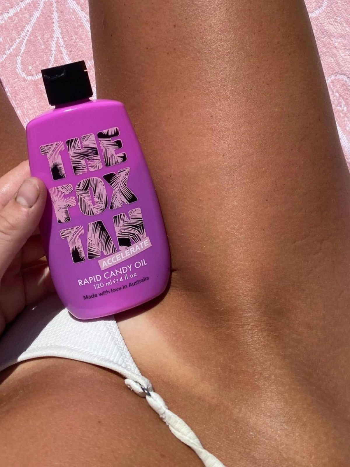 Close-up of macadamia, jojoba, almond oil blend in The Fox Tan Rapid Candy Oil.
