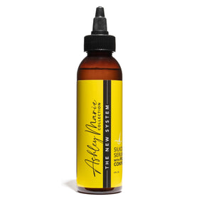 The Hair Diagram Silk Out Serum on damp hair for smooth ends.