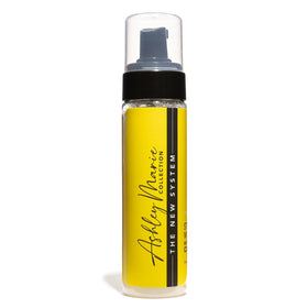 Ashley Marie Styling Mousse texture close-up shows light, non-flaking formula.