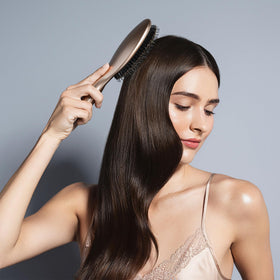The Hair Edit Finish & Shine shows boar bristles distributing moisture for shine.