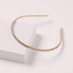 The Hair Edit gold cable headband provides a secure fit for busy days.
