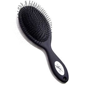 The Hair Shop detangling brush safe for extensions glides through knots with minimal pulling