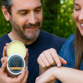The Ilex Wood Calendula Salve eco-packaging highlighting sustainability.
