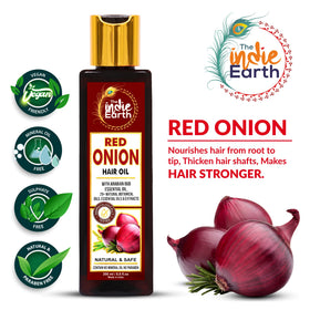 The Indie Earth Red Onion Hair Growth Oil label closeup highlights premium ingredients for scalp nourishment.