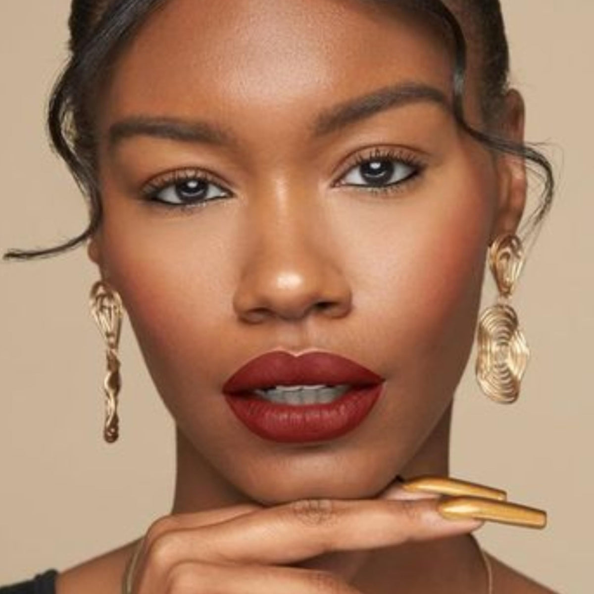 Vegan and cruelty-free branding on The Lip Bar packaging.