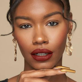 Vegan and cruelty-free branding on The Lip Bar packaging.