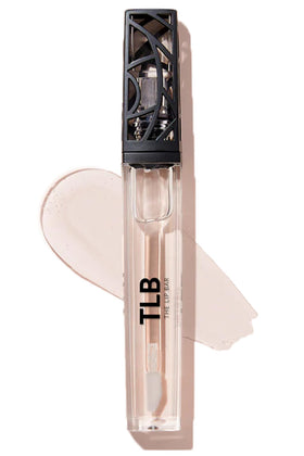 The Lip Bar clear gloss bottle shows high shine and smooth moisture.