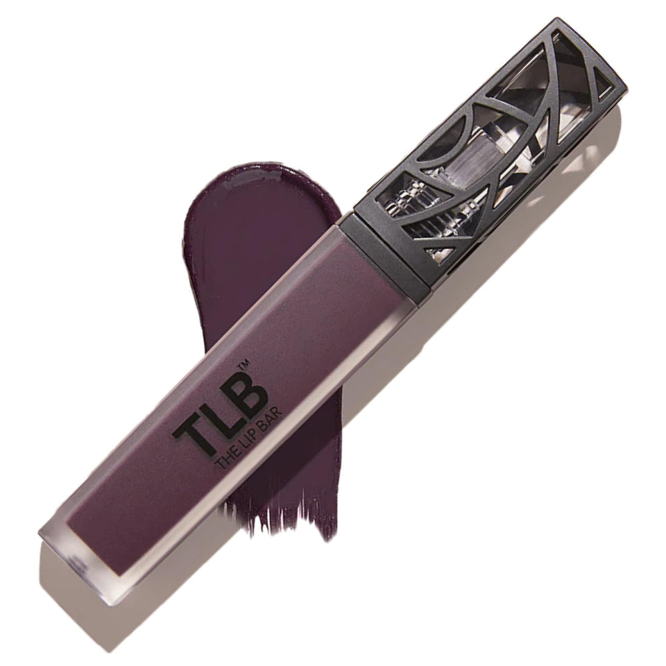 The Lip Bar Drama Queen Deep Eggplant liquid matte application swatch shows bold color and lasting wear.
