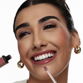 The Lip Bar Upscale Warm Mauve lip gloss applicator close-up demonstrates smooth, mess-free application
