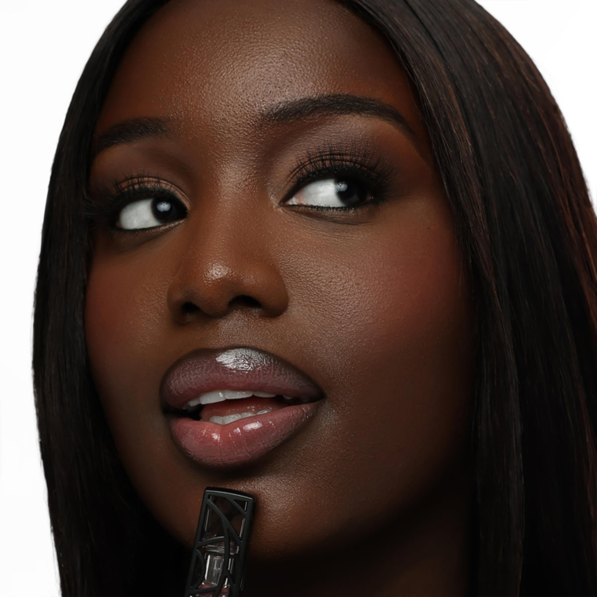 The Lip Bar Upscale Warm Mauve lip gloss swatches on arm show buildable color