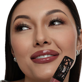 The Lip Bar Upscale Warm Mauve lip gloss label close-up highlights vegan cruelty-free branding