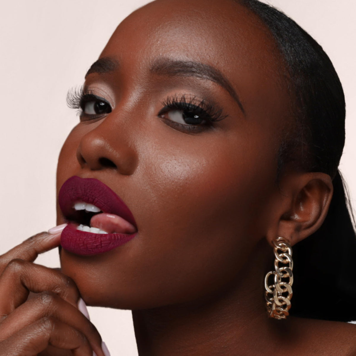 The Lip Bar matte dry-down finish keeps bold color with comfortable lips.