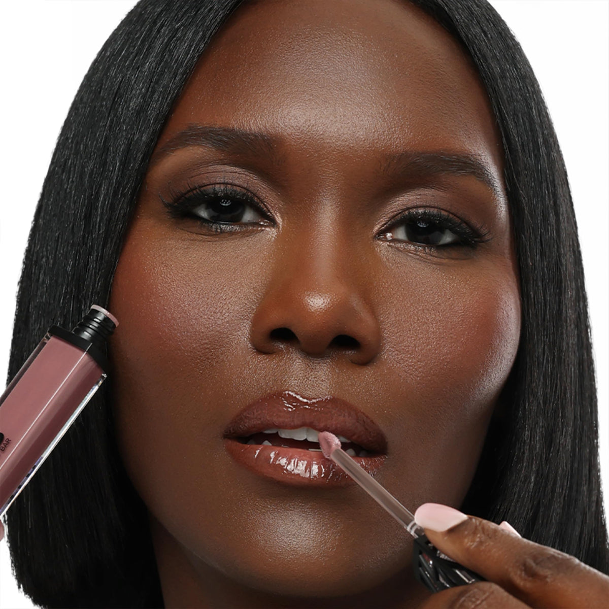 Swatch on lips reveals dusty mauve with natural sheen for a fresh look.