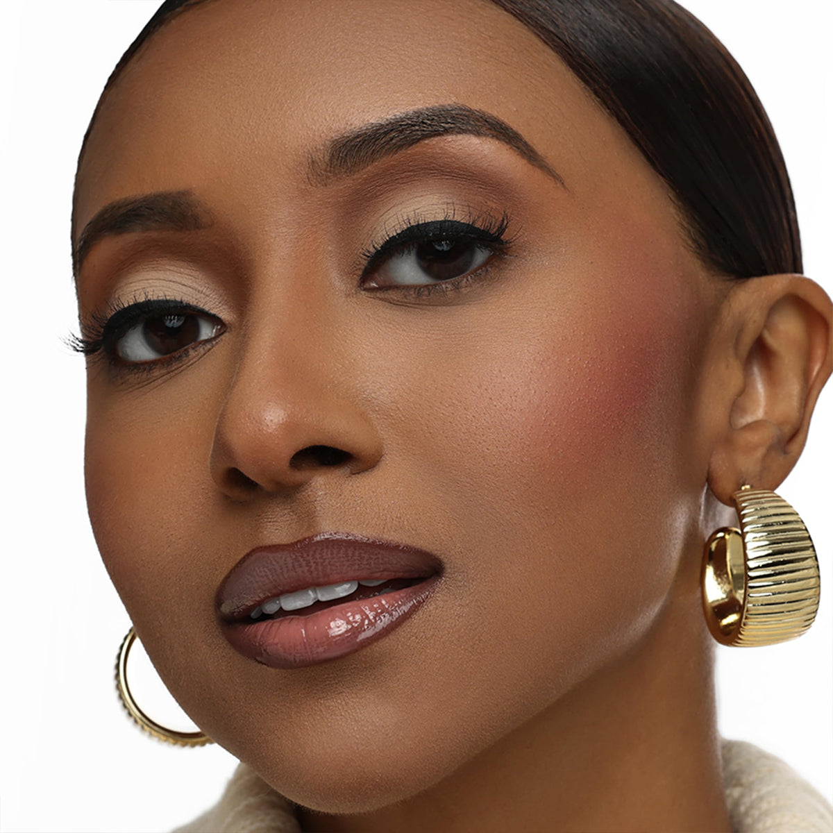 Moisturizing formula with shea butter and oils keeps lips conditioned.
