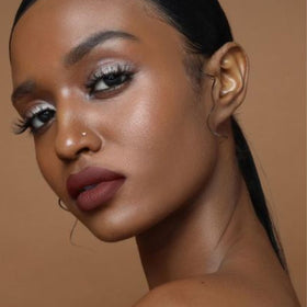 The Lip Bar Savage finish close-up emphasizes velvety color payoff.