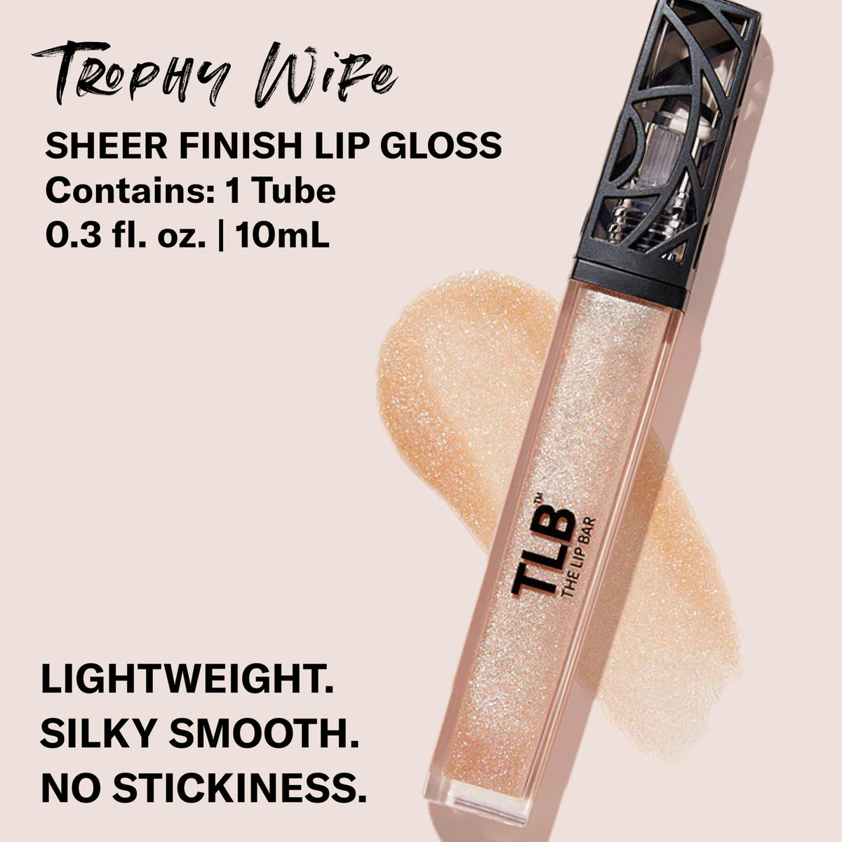 The Lip Bar Trophy Wife gloss on lips shows high-shine, sheer color.