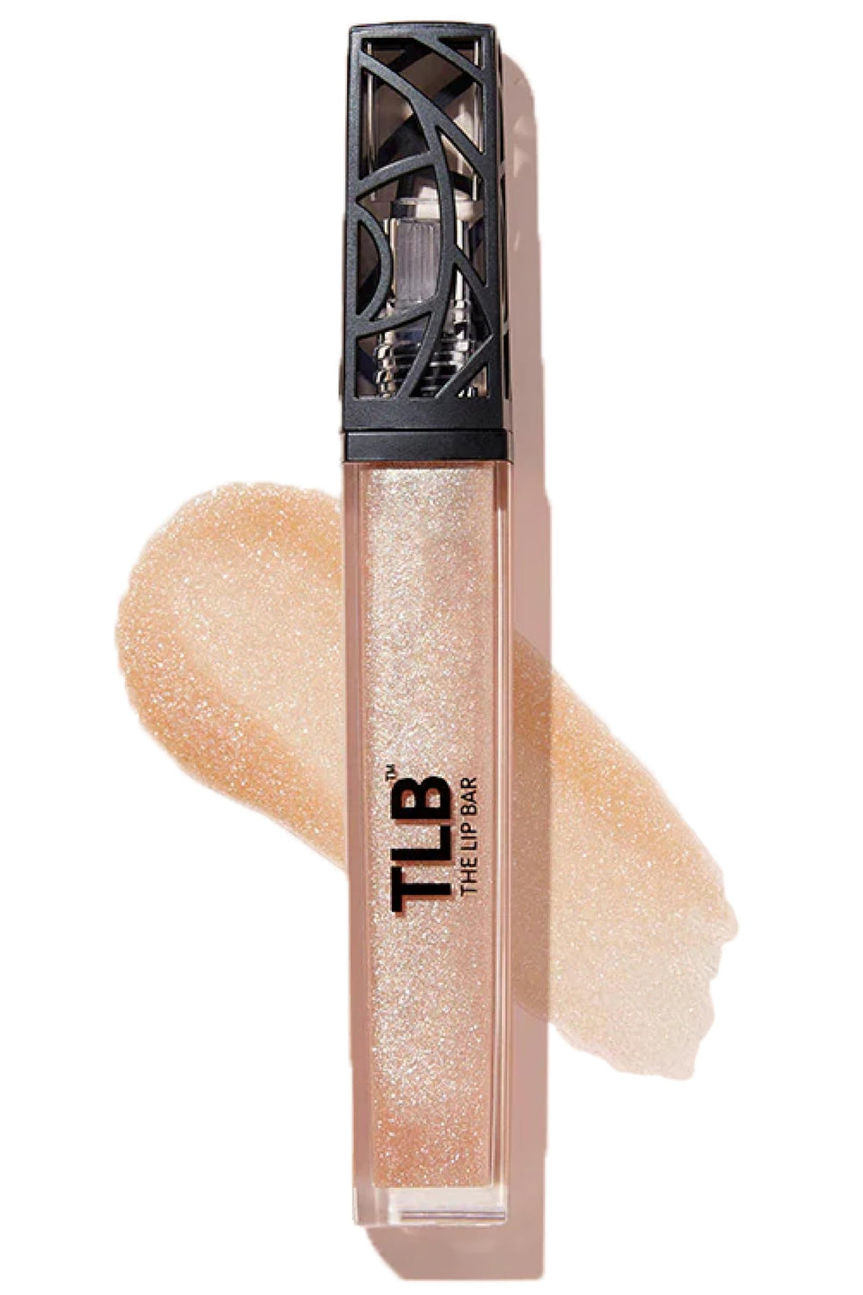 The Lip Bar Trophy Wife gloss tube close-up highlights champagne shimmer.